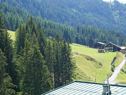 a view of a hill with a house and trees at Apartment Elisabeth by Interhome in Ochsengarten