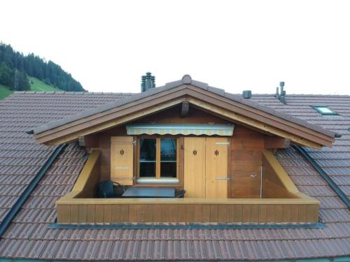 a small house on top of a roof at Apartment Am Liimerweg by Interhome in Adelboden