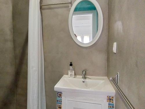 a bathroom with a sink and a mirror at Holiday Home Rainbow by Interhome in Benidorm