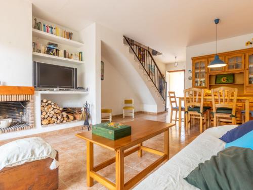 a living room with a couch and a table at Holiday Home Boters-1 by Interhome in Torredembarra