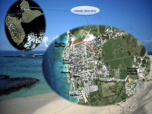 a map of a sandy beach with the ocean at Caraibe Créol' Keys in Port-Louis