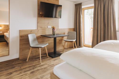 Ein Bett oder Betten in einem Zimmer der Unterkunft Sinnes Waldrast