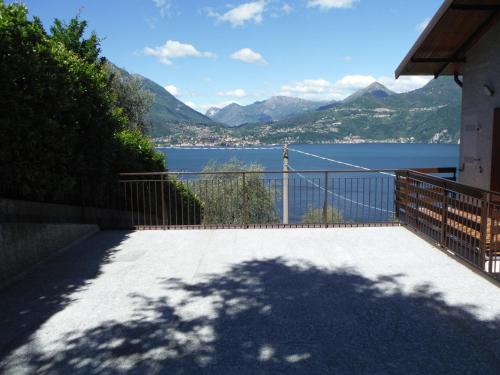 a balcony with a view of a lake and mountains at Villa Bianca in Varenna