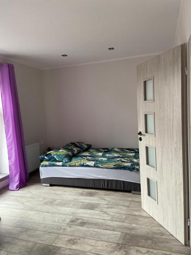 Postel nebo postele na pokoji v ubytování Apartamenty Bezrzecze
