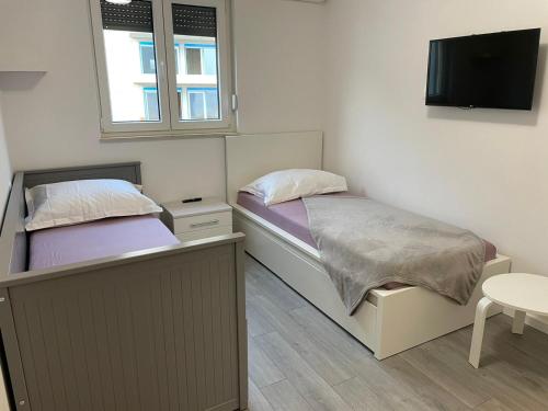 Posteľ alebo postele v izbe v ubytovaní Apartment LJUBICA