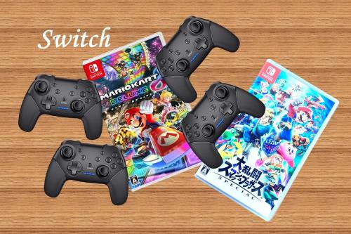 two video game controllers and a nintendo wii game box at 一棟貸切 森のお風呂とアウトドアサウナ 日光雪月花 in Nikko