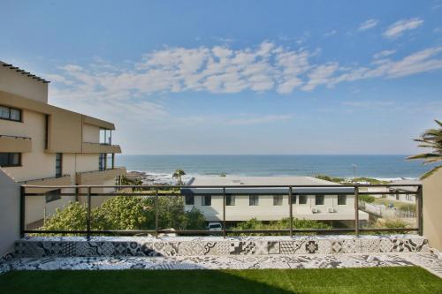 a view of the ocean from the balcony of a building at Simla Luxury Apartments in Margate