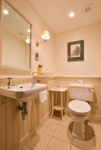 a bathroom with a toilet and a sink at Barcaldine Castle in Oban