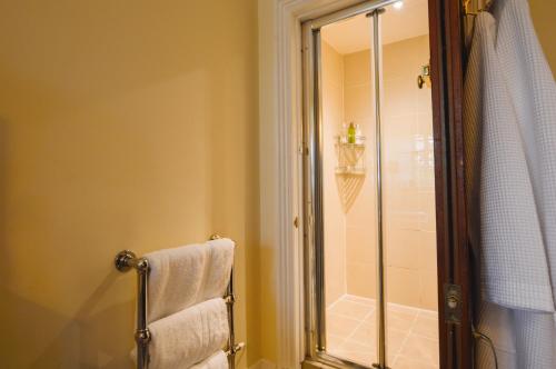 a bathroom with a shower and a towel at Barcaldine Castle in Oban