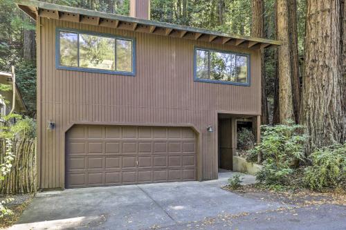 a brown house with a garage in the woods at Tranquil Guerneville Home with Redwood Views in Guerneville