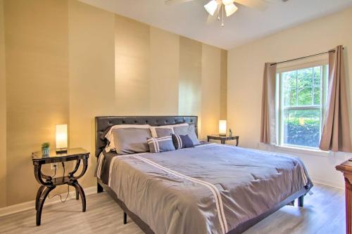 a bedroom with a large bed and a window at Porch and Community Perks Walkable Lewes Condo in Lewes