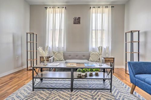 a living room with a couch and a table at Updated Bayonne Townhome about 11 Mi to NYC! in Bayonne