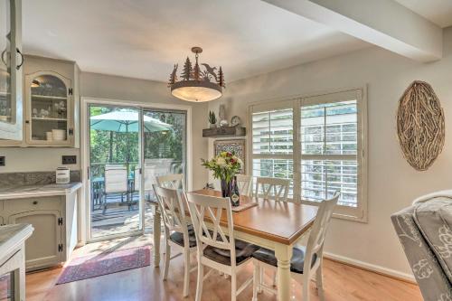 a kitchen and dining room with a table and chairs at 1 Mi to Jenkinson Lake Apples Chalet with Deck in Pollock Pines