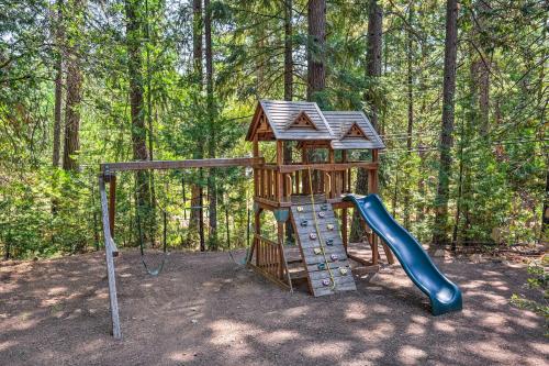 a small playground with a slide and a slideintend at 1 Mi to Jenkinson Lake Apples Chalet with Deck in Pollock Pines