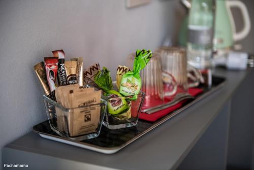 a tray with food and drinks on a counter at San Francesco Guest House in Savigliano