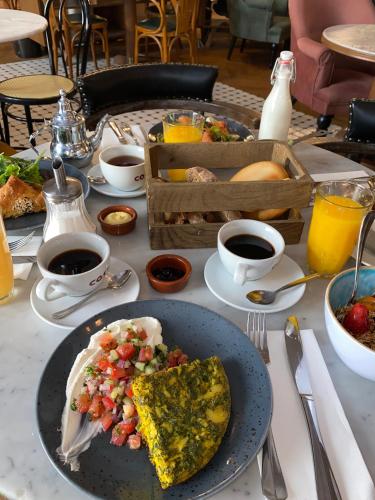 a table with a plate of food on a table at Craves in Brussels