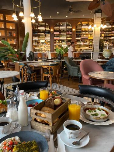 a table with food and drinks in a restaurant at Craves in Brussels