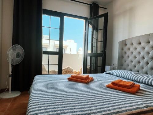 Postel nebo postele na pokoji v ubytování Exclusiva Villa de Lujo (5*****) en Corralejo - Fuerteventura (Islas Canarias)