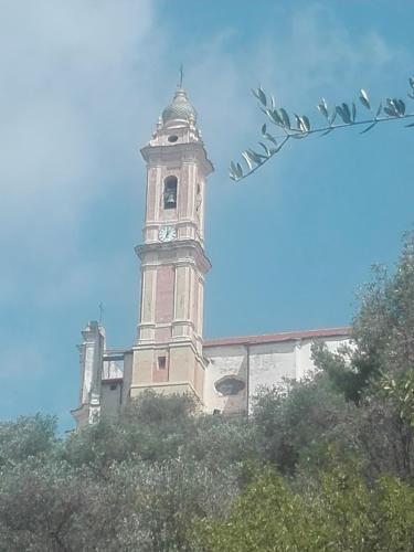 a clock tower on top of a building at Plan B in Imperia