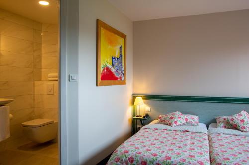 Postel nebo postele na pokoji v ubytování Auberge Ramstein Hôtel - Restaurant