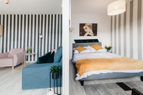 Posteľ alebo postele v izbe v ubytovaní Nocosfera Apartament Górnośląski