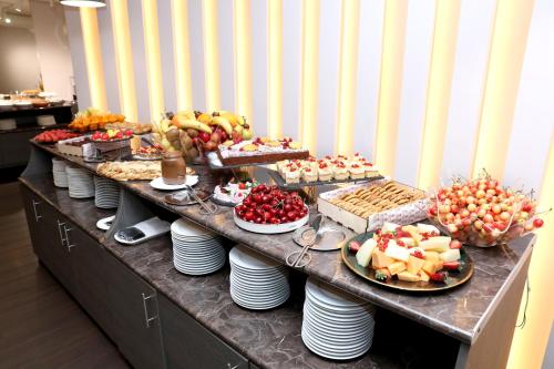 a buffet line with many different types of food at Best Western Plus Paradise Hotel Dilijan in Dilijan