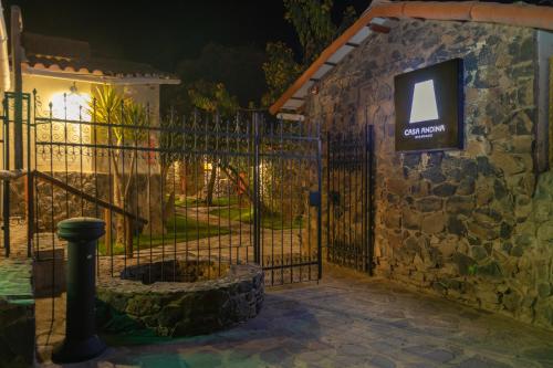 a gate with a stone building with a sign on it at Casa Andina Standard Colca in Chivay