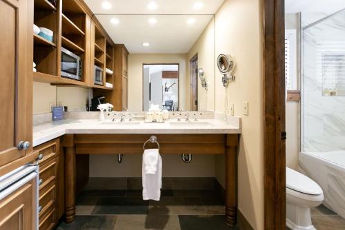 a bathroom with a large sink and a toilet at Deluxe King Hotel Room in Park City