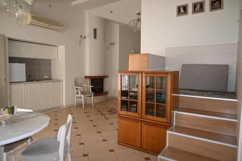 a living room with a kitchen and a dining room at Villa Magicland in Sofia