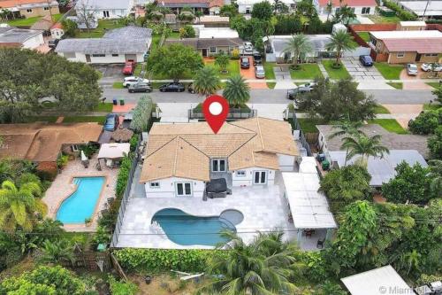 an aerial view of a house with a red marker on it at Miami House with Hot Pool-spa & Pool table L48 in Hialeah