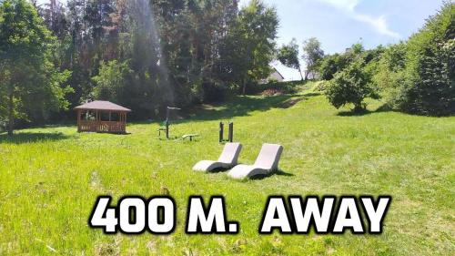 a sign that says zoo masy in a field at "Trakaitis" apartments & holiday homes in Trakai