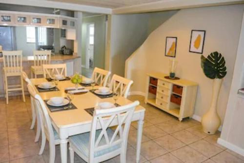 a kitchen and dining room with a table and chairs at The Bliss in Gros Islet
