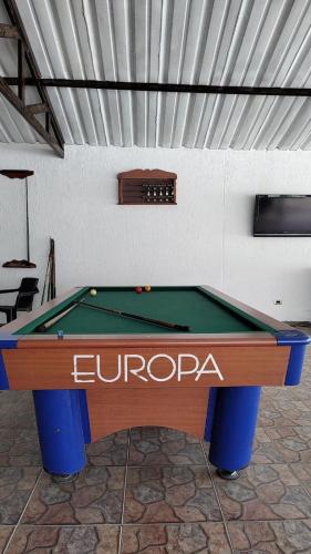 a pool table sitting in a room with at Cabañas LLano Lindo Apiay in Villavicencio