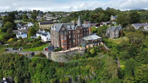 an aerial view of a castle on a hill at Western Isles Hotel in Tobermory