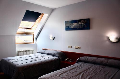 Postel nebo postele na pokoji v ubytování Hotel As Camelias