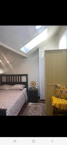 a bedroom with two beds and a ceiling at Appartement T LUXE in Pierrefitte-sur-Seine
