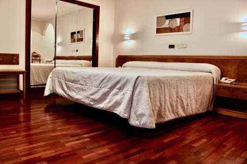Postel nebo postele na pokoji v ubytování Hotel As Camelias
