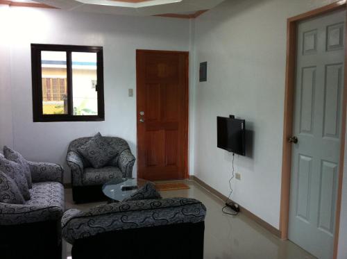 TV a/nebo společenská místnost v ubytování Rullan Apartelle