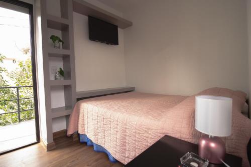 Cama o camas de una habitación en Lofts Amore