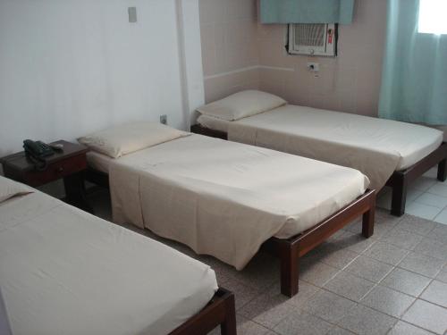 Postel nebo postele na pokoji v ubytování Pousada Terra de Minas