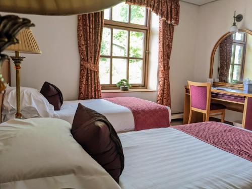 Ένα ή περισσότερα κρεβάτια σε δωμάτιο στο Whitewater Hotel & Spa