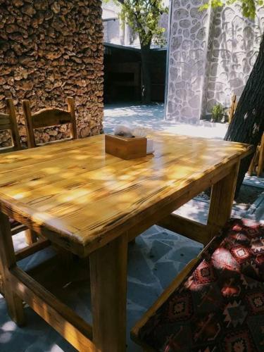a wooden table with a box on top of it at Zangezur Hotel in Goris