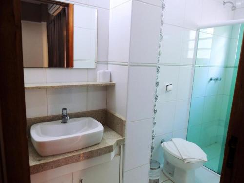 a bathroom with a sink and a toilet at Bonno Hotel Paulínia in Paulínia