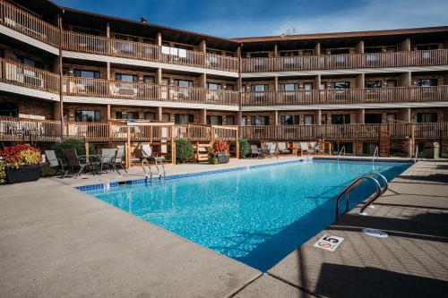 a large swimming pool in front of a building at Aloha Beach Resort in Wisconsin Dells