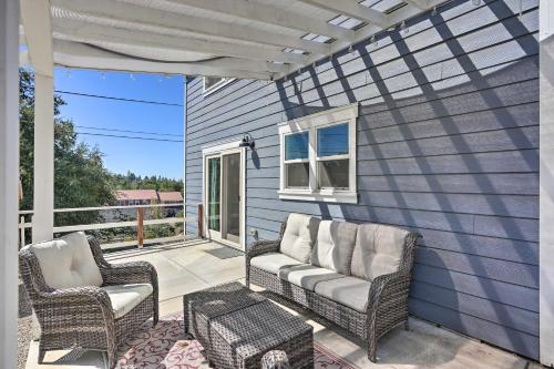 a patio with two chairs and a table at Sierra Sunset Inn - 3 Miles to Placerville! in Placerville