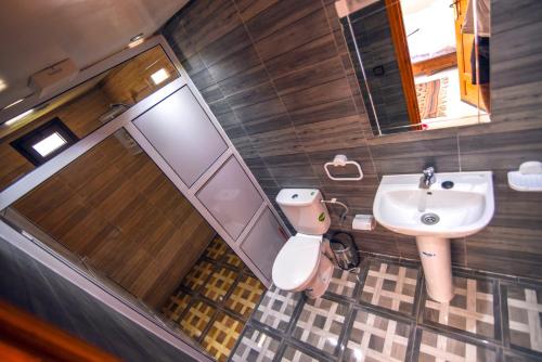 a bathroom with a sink and a toilet at Kasbah Roseville in Ait Sedrate Sahl Gharbia