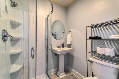 a bathroom with a shower and a sink and a toilet at Stylish Wilmington Home, 2 Mi to Riverwalk! in Wilmington