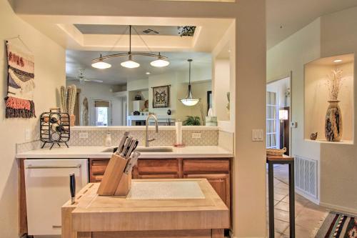 a kitchen with a sink and a counter at Scottsdale Condo with Balcony and Resort Amenities! in Scottsdale