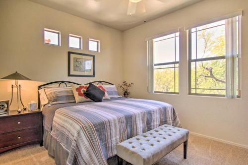 a bedroom with a bed and a dresser and windows at Scottsdale Condo with Balcony and Resort Amenities! in Scottsdale
