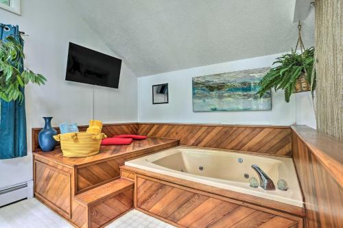 a large bath tub in a room with a tv at Poconos Gem Fire Pit, Hot Tub, Community Pool in East Stroudsburg